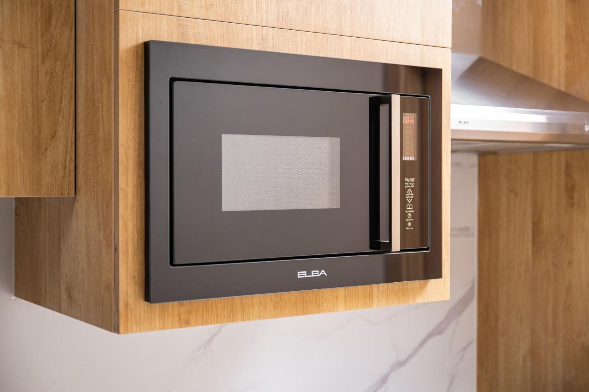 Taiba Suites Madinah Medina Exterior foto Microwaves are a common household appliance.